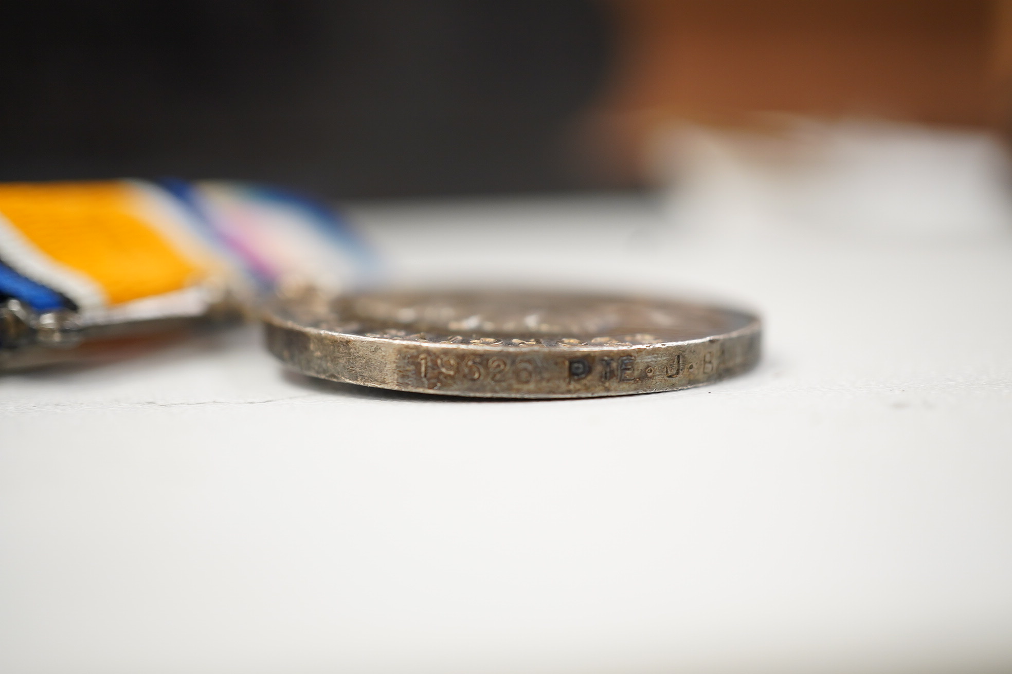 A First World War medal trio awarded to Pte. J. Ball Oxf. & Bucks. L.I., together with an oak mantle clock inset with a memorial plaque awarded to George John Ball, plus related paperwork. Condition - fair to good